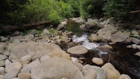 Low drone shot over a creek in Italy Stock Footage 87300053