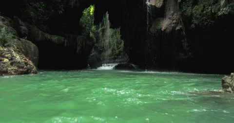 Low Drone Shot of River Flow Through Narrow Tropical Canyon with Rocks 스톡 동영상 332606296
