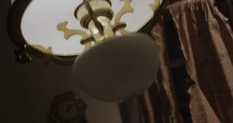 Low Dutch Angle of Lamp Swinging 스톡 동영상 125916740