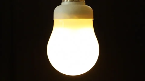 Low energy light buld switches on Stock Footage
