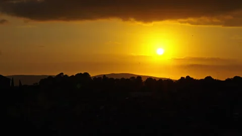 Low Evening Sun Breaking Through Layered Clouds Vidéo 256179896