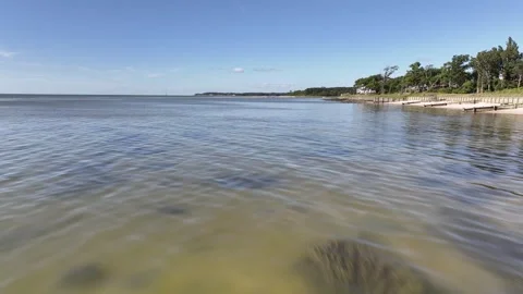 Low fast drone flight over Chesapeake Bay shoreline 스톡 동영상 280447726