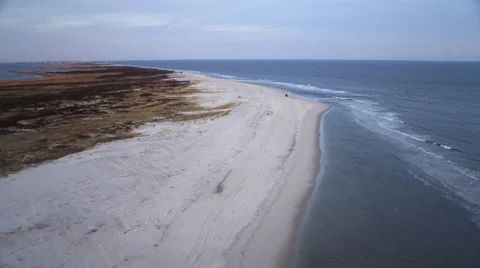 Low fast flight above beach and surf, heading for Beach Haven, New Jersey. Shot Stock Footage 59219971