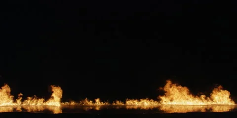 Low flames the width of the screen slowly dying down even lower Stock Footage 59124930