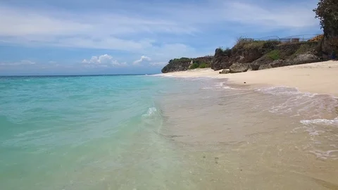 Low flight above sandy beach and azure ocean Stock Footage 108680351