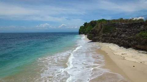 Low flight above sandy beach and azure ocean Stock Footage 108680560