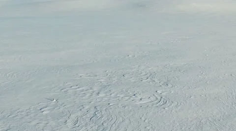 Low flight above snow fields in winter, aerial panoramic view. Video stock 67758987