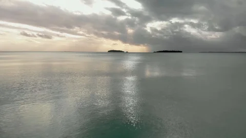 Low flight aerial view isolate islands called motus in Aitutaki Lagoon Stock Footage 107753094