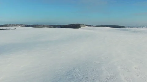 Low flight and takeoff above snow fields in winter, aerial panoramic view. Video stock 67759002