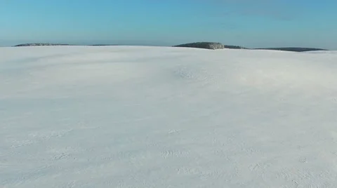Low flight and takeoff above snow fields in winter, aerial panoramic view. Video stock 67759029
