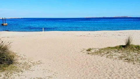Low flight on beach towards blue sea Stock Footage 128842431