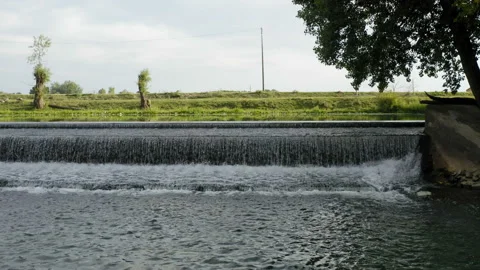Low flight over a beautiful waterfall on a small river Stockbeeldmateriaal 138533298