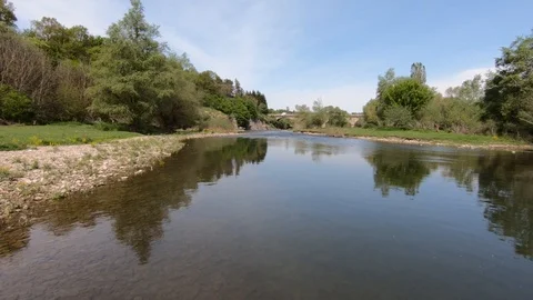 A low flight over a calm river in the plain Stock Footage 109507618