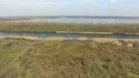 Low flight over the marsh and lake Stock Footage 63079194