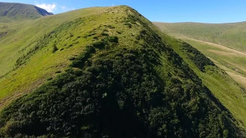 Low flight over mountain range in bright summer day Stock Footage 79096937