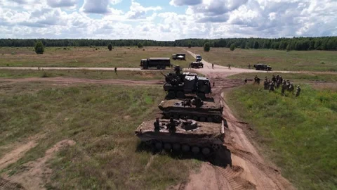 Low flight over NATO armour Stock Footage 250980083