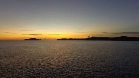 Low Flight Over Ocean at Sunset Panama Drone Video Stock Footage 129060272