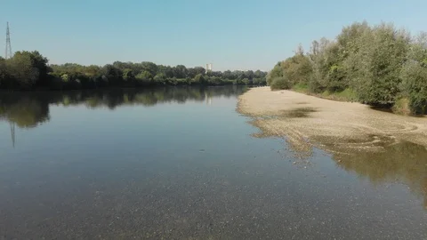 Low flight over river shore Stock Footage 115730419