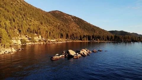 Low Flight Over Rocks in Lake Tahoe Stock Footage 114688730