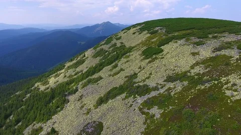 Low flight over rocky mountain ridge in summer day Stock Footage 79712599