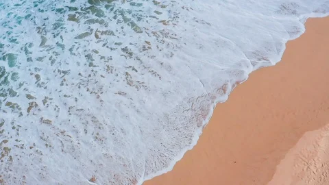 Low Flight Over the Sandy Beach and Waves Stock Footage 105197124