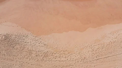 Low Flight Over the Sandy Beach and Waves Stock Footage 105197604