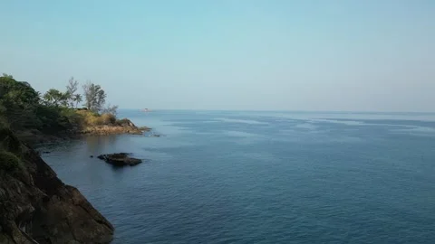 Low flight over a sea bay with a rocky shore. Drone video Stock Footage 300280490