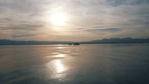 Low flight over the sea during the sunset Stock Footage 88730381