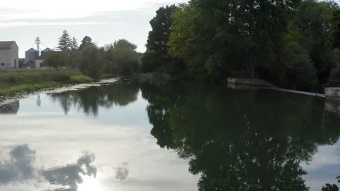 Low flight over a small rural river on a cloudy day Stockbeeldmateriaal 138531060
