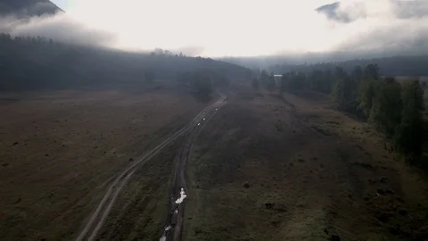 Low flight over the valley clouds mountains green trees. 4K aerial view. Stock Footage 123111087