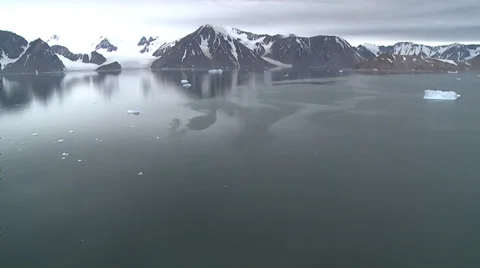 Low flight over very calm sea to mountains, Antarctica Stock Footage 34310964