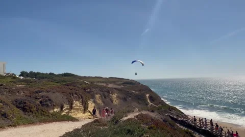 Low Flight Paragliding Over Sea Handheld Shot Video stock 250104641