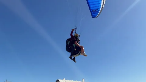 Low Flight Paragliding Passenger Over Sea Handheld Shot Stock-Footage 249333868