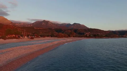 Low flight parallel to the coast of Kardamyli, Greece, at dusk Stock-Footage 151222433