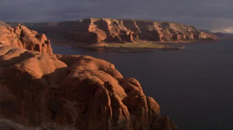 Low flight toward Lake Powell on a stormy evening Stock Footage 59526114