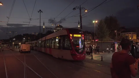 A low-floor tram and a garbage truck, Istanbul, Turkey Stock Footage 243472490
