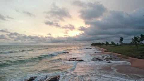 Low fly back over tropical beach at sunset Video stock 229016805