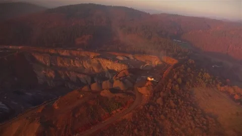 Low fly inn a open cast mining complex in the sunset. Stock Footage 143537786