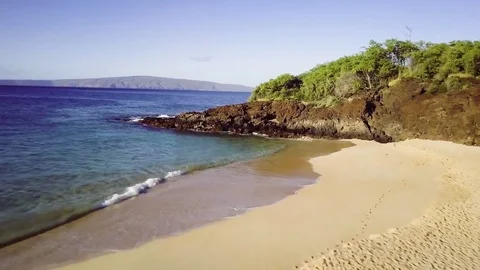 Low Fly Over A Beautiful Beach &amp; Rocky Headland With Green Vegetation At Sunrise Stockbeeldmateriaal 83959842