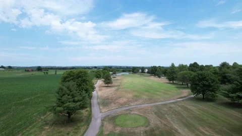Low fly over golf course hole, aerial drone Stock Footage 201311244