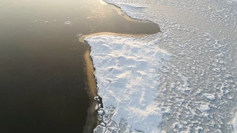Low fly over winter lake or river with ice floes at sunset 스톡 동영상 123200654