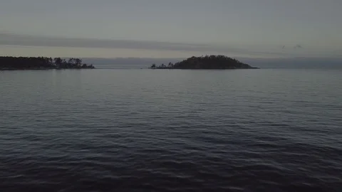 Low fly towards island Stock Footage 85570748