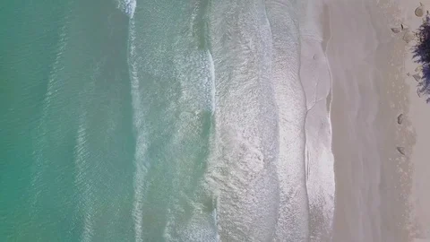 Low flying above the beach, and blue ocean Aerial view of beautiful beach 動画素材 74644617
