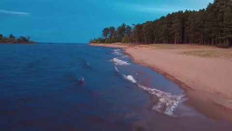 Low Flying Aerial Down Little Presque Isle Shoreline Sunset Stock Footage