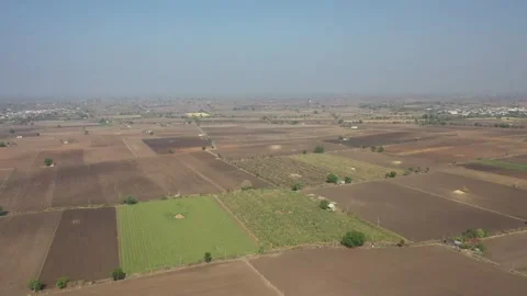 Low flying aerial panorama showcasing a mosaic of agricultural fields with Vídeos de archivo 337127746