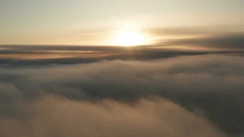 Low flying airplane window shot over fog mist and cloud aerial Stock Footage 118590113