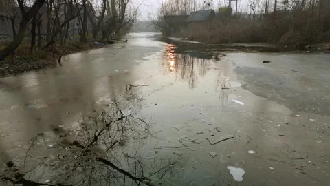 Low flying drone capturing the frozen dal interiors with sun reflection on Stock Footage 311020508