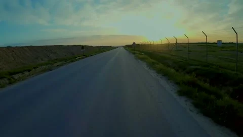 LOW FLYING DRONE FLYING INTO SUNSET Stock Footage 150692099