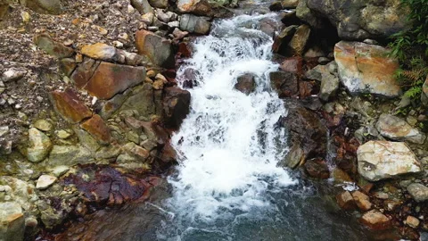 Low flying drone moves forward above a small river Stock Footage 328698230