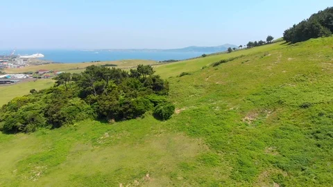 Low flying drone over fields and sea Video stock 91092283